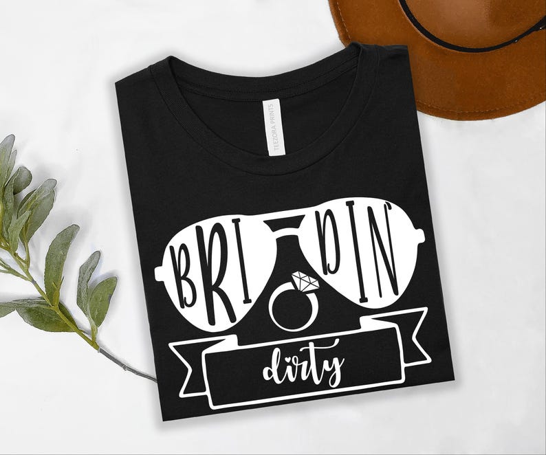 Bride Squad Matching Bachelorette T Shirts are designed for brides and their favourite people to celebrate in coordinated style. Featuring matching "They See Us Rollin' We Celebratin'" graphics with a personalised Bride shirt, this premium collection from Teezora Prints offers exceptional comfort and professional print quality, making it ideal for bridal showers, hen weekends, destination weddings, girls' holidays, and unforgettable wedding celebrations.