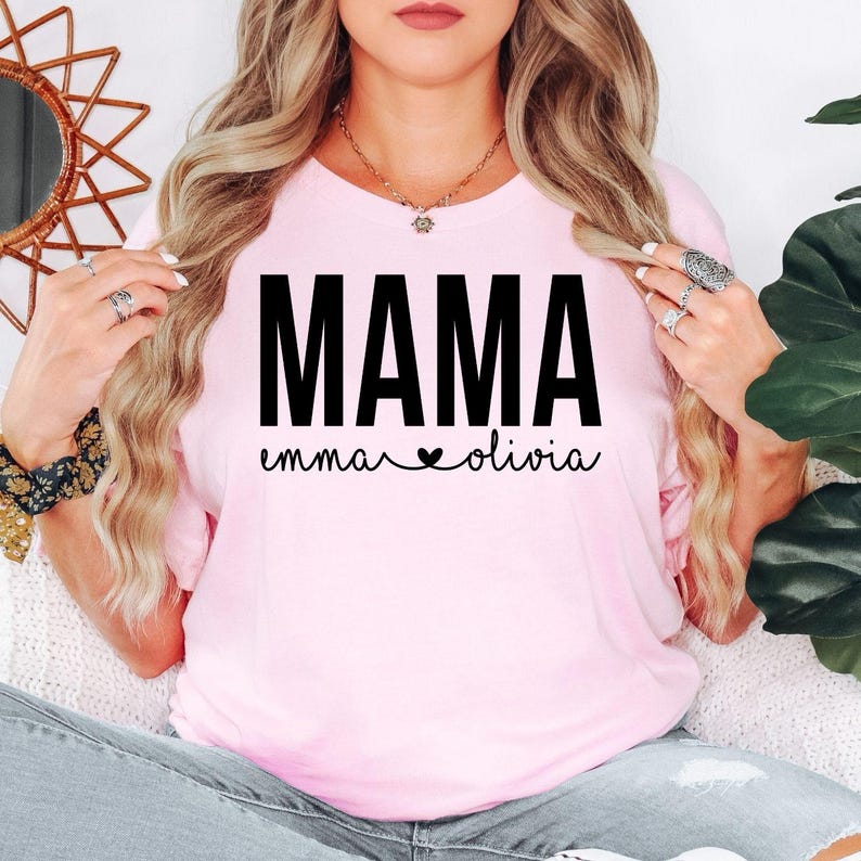 Personalised Mama T Shirt created for mums, new mums, mothers, wives, grandmothers, mums-to-be, and proud women celebrating motherhood. Featuring a custom children’s names design beneath the bold MAMA typography with a heart detail, this premium Mother's Day gift from Teezora Prints offers exceptional comfort, premium print quality, and timeless everyday fashion for every proud mum.