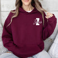 Personalised monogram hoodie customised with your chosen initial and name in a stylish script font. Customers can create a one-of-a-kind hoodie featuring their own name, nickname, family surname or meaningful text. Ideal for personalised fashion, matching family outfits and custom gift giving occasions.