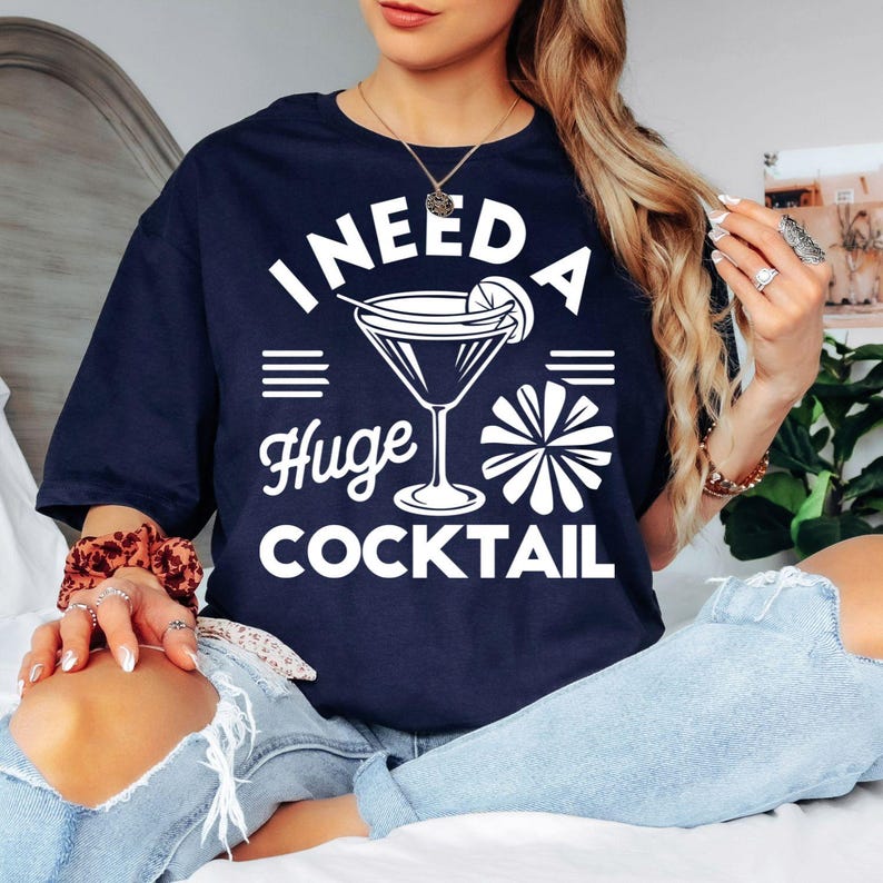 Funny cocktail lover t shirt featuring a bold drinking quote and cocktail glass graphic, perfect for customers searching cocktail party shirt, girls trip outfit, funny alcohol t shirt, hen party clothing, bachelorette shirt, cocktail gift for women, birthday party apparel, brunch outfit, novelty drinking tee, humorous graphic shirt, and unique party fashion. Designed for women who love cocktails, celebrations, and stylish casual clothing.