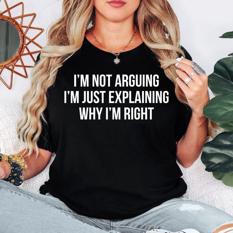 Funny sarcastic t shirt designed for men and women who enjoy witty humour, clever comebacks, and bold statement clothing. Featuring the quote "I'm Not Arguing I'm Just Explaining Why I'm Right" in a clean typography design, this premium graphic tee is perfect for friends, family, colleagues, husbands, wives, and anyone known for always having the last word. A stylish everyday shirt for humour lovers who appreciate sarcasm and funny conversations.
