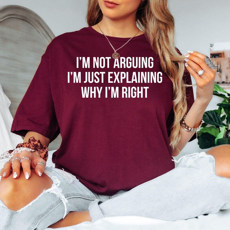 Funny sarcastic quote t shirt featuring the phrase "I'm Not Arguing I'm Just Explaining Why I'm Right" in a bold minimalist typography design. Perfect for customers searching sarcastic quote shirts, funny slogan t shirts, novelty humour clothing, witty graphic tees, office humour apparel, joke shirts, statement t shirts, funny birthday gifts, sarcastic gifts for friends, and unique everyday graphic clothing.