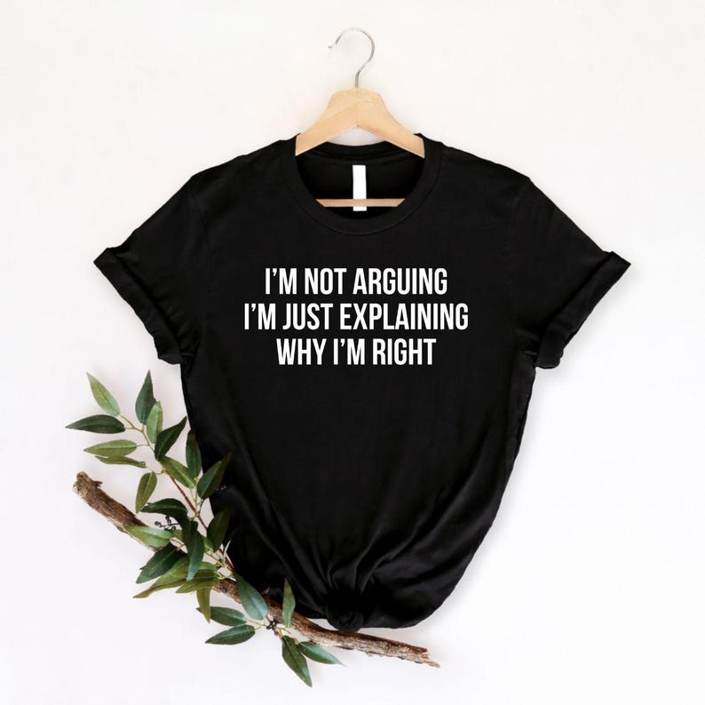 Funny sarcastic t shirt designed for men and women who enjoy witty humour, clever comebacks, and bold statement clothing. Featuring the quote "I'm Not Arguing I'm Just Explaining Why I'm Right" in a clean typography design, this premium graphic tee is perfect for friends, family, colleagues, husbands, wives, and anyone known for always having the last word. A stylish everyday shirt for humour lovers who appreciate sarcasm and funny conversations.