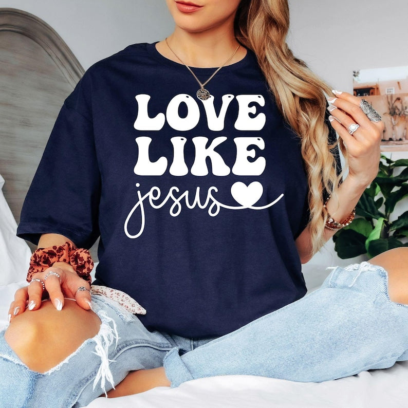 Searching for a meaningful Christian gift? This Love Like Jesus t shirt features a beautiful faith-inspired typography design that shares a powerful message of kindness and compassion. Professionally printed on a premium quality t shirt, it provides lasting comfort and style. Perfect for birthdays, Mother's Day, Christmas, baptisms, Easter, church events, Bible study groups, and thoughtful gifts for believers.