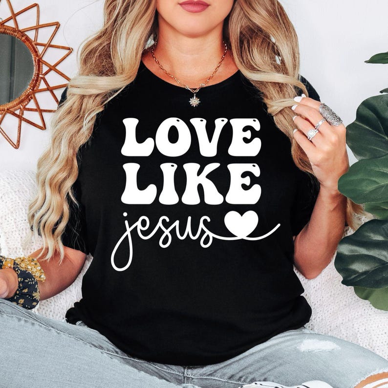 Love Like Jesus Christian t shirt designed for men and women who proudly live their Christian faith and enjoy inspirational Bible-based clothing. Featuring a bold "Love Like Jesus" message with a stylish typography design, this premium graphic tee is perfect for believers, church members, worship leaders, Bible study groups, youth ministries, pastors, family members, and anyone who wants to share God's love through meaningful Christian apparel.