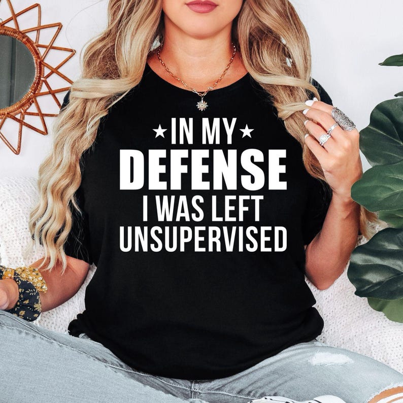 In My Defense I Was Left Unsupervised T Shirt created for sarcastic adults, witty personalities, introverts, extroverts, office workers, teachers, parents, friends, coworkers, and anyone who enjoys clever humour. Featuring bold typography with a funny statement, this premium graphic tee from Teezora Prints celebrates confidence, personality, and everyday laughter while delivering exceptional comfort, premium print quality, and stylish casual fashion for humour lovers.