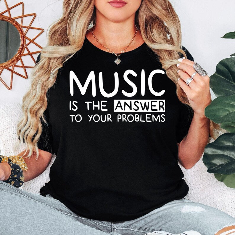 Music Is The Answer To Your Problems t shirt created for musicians, singers, music teachers, DJs, producers, guitarists, pianists, drummers, choir members, students, music lovers, and anyone who believes music makes every day better. Featuring a bold typography design with an uplifting message, this premium graphic tee celebrates creativity, passion, positivity, and self-expression while offering outstanding comfort, durable print quality, and stylish everyday fashion for concerts, rehearsals, festivals, an