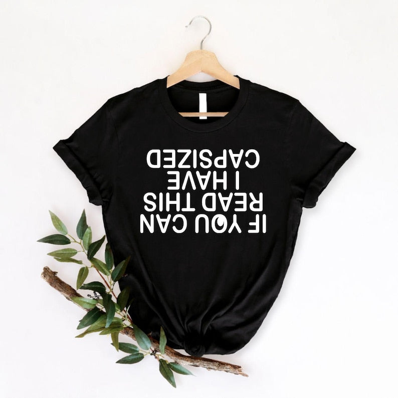Funny kayaking t shirt featuring the quote If You Can Read This I Have Capsized in an upside-down typography layout created for kayaking enthusiasts, canoe lovers, paddlers, and outdoor adventurers. Perfect for customers searching funny kayaking shirts, canoe humour clothing, kayaking quote t shirts, paddling apparel, water sports gifts, lake life shirts, river adventure clothing, camping graphic tees, boating humour shirts, kayak club apparel, premium outdoor fashion, and unique kayaking gifts with modern 