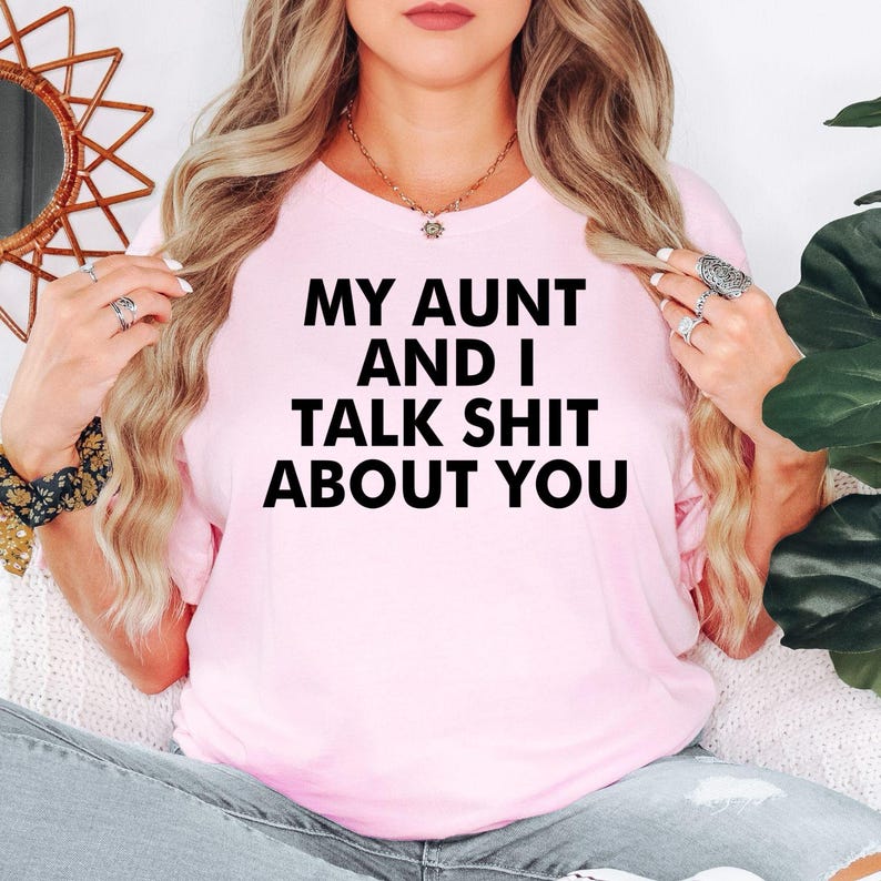 My Aunt And I Talk Shit About You t shirt makes a memorable gift for aunts, nieces, nephews, sisters, cousins, best friends, work friends, and family members with an amazing sense of humour. This premium graphic shirt is perfect for birthdays, Christmas, Family Day, reunions, holidays, girls' weekends, appreciation gifts, and fun surprises for anyone who enjoys bold jokes and sarcastic family conversations.