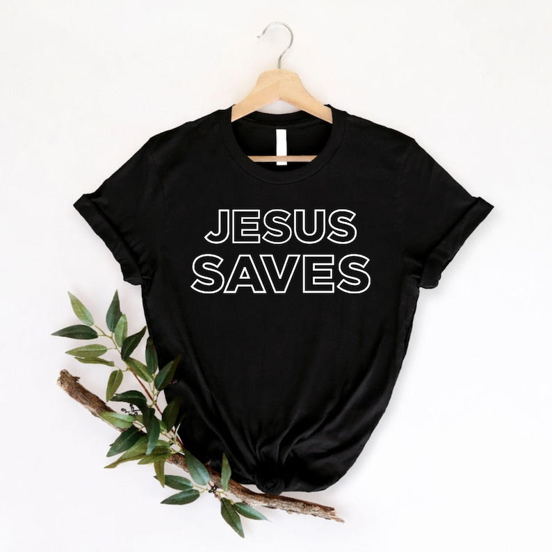 Jesus Saves Christian t shirt featuring a bold faith statement with modern minimalist typography designed for believers who proudly share the Gospel. Perfect for customers searching Jesus Saves shirts, Christian faith apparel, church clothing, Gospel t shirts, worship shirts, Bible-inspired fashion, Christian lifestyle clothing, ministry apparel, religious gifts, Christian graphic tees, premium faith clothing, and inspirational Christian fashion for everyday wear.