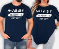 Personalised Hubby Wifey Family Matching T Shirts featuring custom season number and personalised established year designed for couples and families who love matching outfits. Teezora Prints offers premium personalised apparel for customers searching custom couple shirts, matching family tees, personalised anniversary clothing, husband wife matching shirts, wedding anniversary gifts, family celebration outfits, and unique personalised matching apparel.