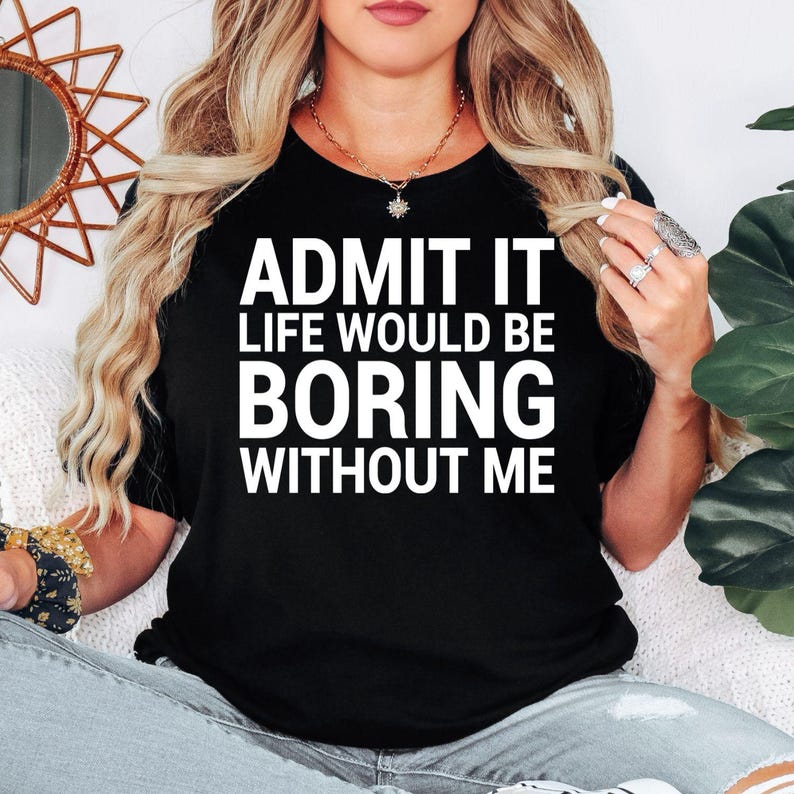 Funny sarcastic t shirt designed for men and women who enjoy witty humour, bold personalities, and clever statement clothing. Featuring the quote "Admit It Life Would Be Boring Without Me" in a clean typography design, this premium graphic tee is perfect for friends, family members, colleagues, husbands, wives, and anyone who enjoys making people laugh. A comfortable everyday shirt that celebrates confidence, humour, individuality, and playful conversations with stylish casual fashion.