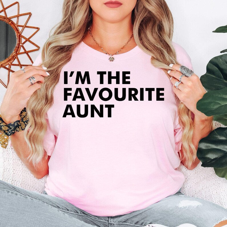 I'm The Favourite Aunt T Shirt makes a thoughtful gift for aunts, aunties, sisters, godmothers, family members, best friends, mothers, wives, daughters, and every woman who enjoys being the fun aunt. Designed by Teezora Prints, this premium graphic shirt is perfect for birthdays, Christmas, Mother's Day, family celebrations, baby announcements, pregnancy reveals, appreciation gifts, and memorable presents from nieces and nephews.