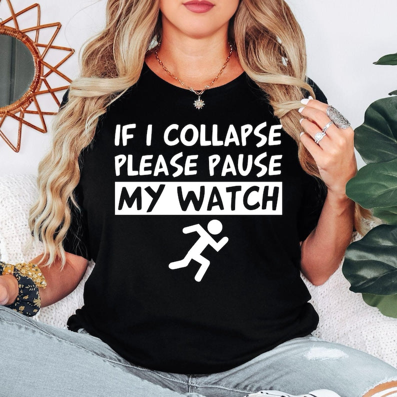 Funny running t shirt designed for marathon runners, joggers, gym lovers, fitness enthusiasts, parkrun participants, and active people who enjoy motivational humour. Featuring the quote "If I Collapse Please Pause My Watch" with a running icon, this premium graphic tee is perfect for athletes, trainers, runners, and sports lovers looking for comfortable everyday fitness clothing with a funny statement.