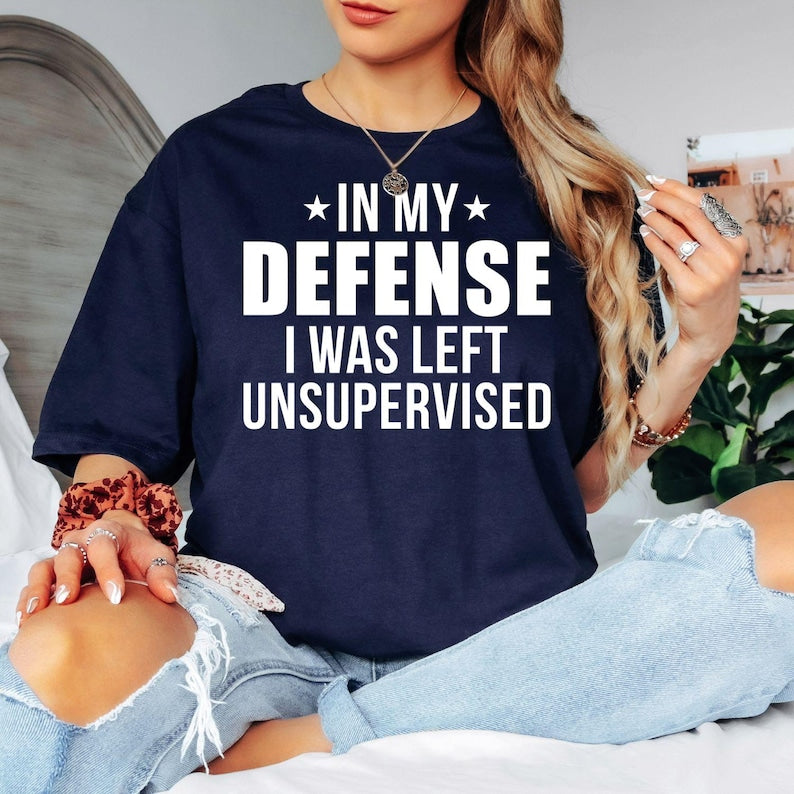 In My Defense I Was Left Unsupervised T Shirt created for sarcastic adults, witty personalities, introverts, extroverts, office workers, teachers, parents, friends, coworkers, and anyone who enjoys clever humour. Featuring bold typography with a funny statement, this premium graphic tee from Teezora Prints celebrates confidence, personality, and everyday laughter while delivering exceptional comfort, premium print quality, and stylish casual fashion for humour lovers.