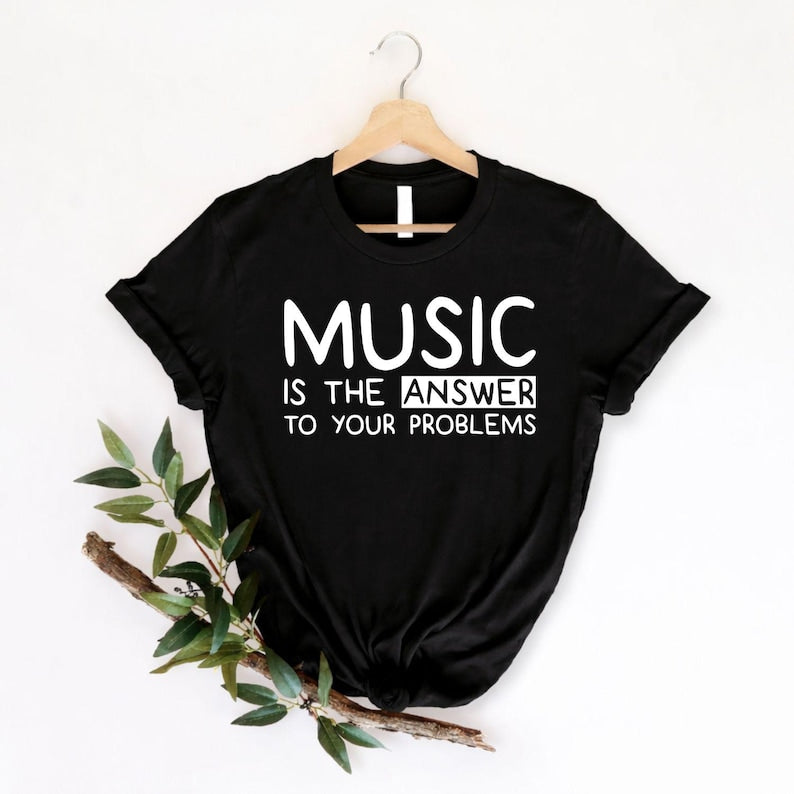 Music Is The Answer To Your Problems t shirt featuring a modern typography design created for musicians, singers, teachers, DJs, and passionate music lovers. Perfect for customers searching music lover shirts, inspirational music tees, musician clothing, music teacher gifts, concert apparel, choir shirts, music quote t shirts, premium graphic music fashion, unique music lover gifts, and stylish everyday clothing inspired by the power of music.