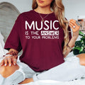 Searching for the perfect gift for someone who lives and breathes music? This Music Is The Answer To Your Problems t shirt features a bold typography design with a positive message that every music lover can relate to. Professionally printed on a premium quality unisex t shirt, it provides exceptional comfort, long-lasting durability, and timeless style. Perfect for birthdays, Christmas, music festivals, concerts, rehearsals, music lessons, and thoughtful gifts for musicians, singers, DJs, teachers, and mus