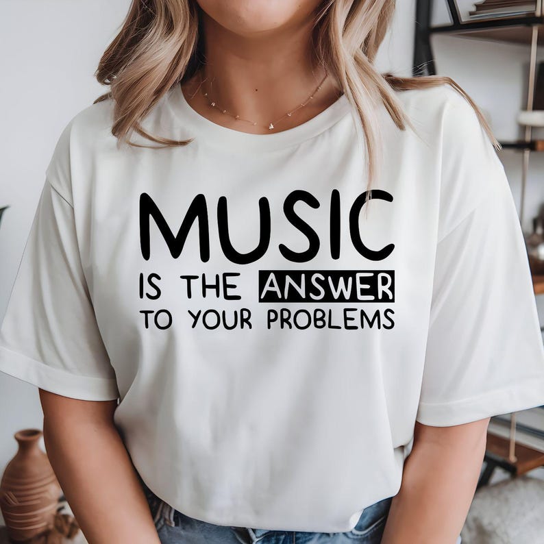Music Is The Answer To Your Problems t shirt created for musicians, singers, music teachers, DJs, producers, guitarists, pianists, drummers, choir members, students, music lovers, and anyone who believes music makes every day better. Featuring a bold typography design with an uplifting message, this premium graphic tee celebrates creativity, passion, positivity, and self-expression while offering outstanding comfort, durable print quality, and stylish everyday fashion for concerts, rehearsals, festivals, an