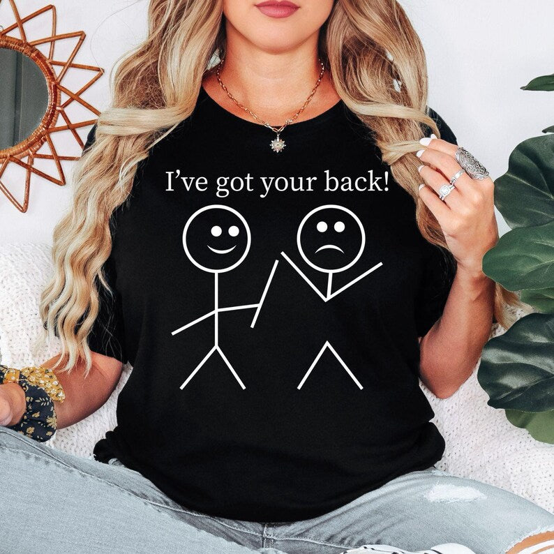 I've Got Your Back t shirt created for best friends, supportive partners, family members, classmates, colleagues, teachers, students, teammates, and anyone who believes kindness and loyalty matter. Featuring a clever stick figure illustration with the uplifting message "I've Got Your Back," this premium graphic tee celebrates friendship, encouragement, trust, compassion, and everyday positivity. Perfect for people who enjoy meaningful humour, thoughtful fashion, and comfortable casual clothing that spreads 
