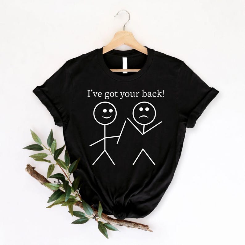 I've Got Your Back t shirt created for best friends, supportive partners, family members, classmates, colleagues, teachers, students, teammates, and anyone who believes kindness and loyalty matter. Featuring a clever stick figure illustration with the uplifting message "I've Got Your Back," this premium graphic tee celebrates friendship, encouragement, trust, compassion, and everyday positivity. Perfect for people who enjoy meaningful humour, thoughtful fashion, and comfortable casual clothing that spreads 