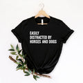 Easily Distracted By Horses And Dogs t shirt created for horse lovers, dog lovers, equestrians, riders, pet parents, animal rescuers, stable owners, trainers, veterinarians, farm life enthusiasts, and anyone whose day instantly gets better after seeing a horse or a dog. Featuring a bold typography design with a playful statement, this premium graphic tee perfectly reflects an animal lover's personality while offering exceptional comfort, durable print quality, stylish everyday fashion, and a fun conversatio
