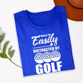 Teezora Prints Sorry I'm Easily Distracted By Golf T Shirt is perfect for golf tournaments, golf club events, driving range practice, weekend golf trips, holidays, sports events, birthdays, retirement parties, Father's Day celebrations, casual everyday wear, golf vacations, family outings, clubhouse gatherings, and outdoor adventures. The bold typography and golf ball design create a fun conversation starter while celebrating a lifelong passion for golf and the golfing lifestyle.