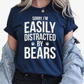 Teezora Prints Searching for the perfect gift for someone who loves bears and the outdoors? This Sorry I'm Easily Distracted By Bears T Shirt features a bold typography design with playful paw print details that every wildlife enthusiast will appreciate. Professionally printed on a premium quality unisex t shirt, it offers outstanding comfort, long-lasting durability, and timeless style. Perfect for birthdays, Christmas, camping trips, hiking adventures, wildlife holidays, Father's Day, Mother's Day, and th