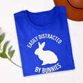 Easily Distracted By Bunnies T Shirt is perfect for bunny shows, pet adoption events, rabbit rescue fundraisers, Easter celebrations, farm visits, countryside holidays, family gatherings, birthdays, casual everyday wear, weekend outings, pet meetups, animal charity events, outdoor adventures, school fairs, and community festivals. Designed by Teezora Prints with a bold rabbit silhouette and modern typography to celebrate every bunny lover's lifestyle.