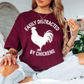Easily Distracted By Chickens T Shirt is perfect for farm visits, poultry shows, agricultural fairs, farmers markets, countryside holidays, homestead events, family gatherings, birthdays, outdoor festivals, casual everyday wear, rural community events, weekend adventures, and relaxing days on the farm. Teezora Prints combines premium quality with a fun farm-inspired design to celebrate everyone who loves chickens and country living.