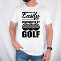 Teezora Prints Sorry I'm Easily Distracted By Golf T Shirt featuring a funny golf quote, bold typography design, golf ball graphic, golfer apparel, golf lover clothing, sports humour fashion, premium printed t shirt, and casual everyday wear. Perfect for customers searching golf lover shirts, funny golfer tees, golf player clothing, golf tournament apparel, golf gifts for men and women, golf club fashion, weekend golfer outfits, premium golf graphic t shirts, and unique golf apparel designed for passionate 