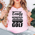 Teezora Prints Sorry I'm Easily Distracted By Golf T Shirt makes an unforgettable gift for golfers, golf coaches, golf club members, dads, mums, grandads, husbands, wives, brothers, sisters, friends, colleagues, and anyone passionate about golf. This premium graphic shirt is perfect for birthdays, Father's Day, Mother's Day, Christmas, retirement celebrations, golf tournaments, club championships, Secret Santa, and thoughtful gifts for every golf enthusiast.