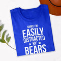 Teezora Prints Sorry I'm Easily Distracted By Bears T Shirt is perfect for camping weekends, hiking trails, national park visits, wildlife tours, mountain holidays, outdoor festivals, family adventures, birthdays, vacations, forest walks, road trips, casual everyday wear, camping clubs, nature photography trips, and outdoor gatherings. The bold typography and paw print design create a fun conversation starter while celebrating a passion for bears, wildlife, and the great outdoors.