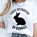Funny Bunny Shirt, Easily Distracted By Bunnies Shirt, Rabbit Lover T Shirt, Bunny Graphic Tee, Pet Rabbit Shirt, Bunny Mum Shirt, Bunny Dad Shirt, Rabbit Owner Shirt, Animal Lover Tee, Bunny Gift, Rabbit Gift, Cute Bunny Shirt, Bunny Apparel, Rabbit Graphic Tee, Funny Animal Shirt, Pet Lover Clothing, Premium Graphic T Shirt by Teezora Prints, Casual Bunny Fashion, Rabbit Lover Gift, Bunny Lover Apparel.