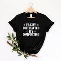 Bring humour to your gardening wardrobe with this Easily Distracted by Composting shirt. The bold graphic design is perfect for compost lovers, home gardeners and eco-friendly lifestyle enthusiasts looking for a comfortable, high-quality t-shirt. Carefully made to order and professionally printed in the UK by TeezoraPrints for outstanding comfort, style and durability.