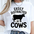 Easily Distracted by Cows shirt, funny cow t shirt, cow lover tee, farm animal shirt, cattle graphic tee, farmer shirt, ranch apparel, dairy farm clothing, livestock lover shirt, country life t shirt and humorous farming gift. Designed for everyday comfort and professionally printed in the UK by TeezoraPrints using premium quality materials.