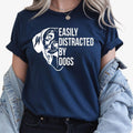 Easily Distracted by Dogs shirt, funny dog lover t shirt, dog mum tee, dog dad shirt, puppy lover shirt, pet owner clothing, dog graphic tee, canine lover apparel, animal lover gift, novelty dog t shirt and casual pet-themed fashion. Designed for comfort and everyday wear, every premium shirt is expertly printed in the UK by TeezoraPrints for lasting quality.