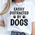 Easily Distracted by Dogs shirt, funny dog lover t shirt, pet lover tee, dog mum shirt, dog dad shirt, puppy lover apparel, paw print shirt, canine lover clothing, novelty dog t shirt, animal lover gift and casual everyday fashion. Every premium tee is carefully printed in the UK by TeezoraPrints for comfort, durability and exceptional print quality.