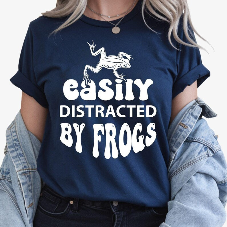 Easily Distracted by Frogs shirt, funny frog lover t shirt, amphibian lover tee, wildlife graphic shirt, nature lover apparel, frog enthusiast clothing, outdoor adventure tee, pond life shirt, novelty animal t shirt and casual wildlife fashion. Every premium shirt is proudly printed in the UK by TeezoraPrints for comfort, durability and professional quality.