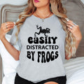 Celebrate your passion for frogs and the natural world with this Easily Distracted by Frogs shirt featuring bold typography and an eye-catching amphibian illustration. Whether you're relaxing outdoors, exploring forests or spending time near lakes and ponds, this premium t-shirt delivers all-day comfort. Every shirt is proudly printed in the UK by TeezoraPrints.