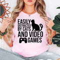 Easily Distracted By Cats And Video Games T Shirt is perfect for gaming nights, LAN parties, esports tournaments, comic conventions, casual weekends, streaming sessions, birthdays, holidays, gaming cafés, family gatherings, college life, everyday casual wear, and relaxing at home with your favourite cat. Teezora Prints combines premium quality with fun gaming style to create a shirt every gamer will enjoy wearing.