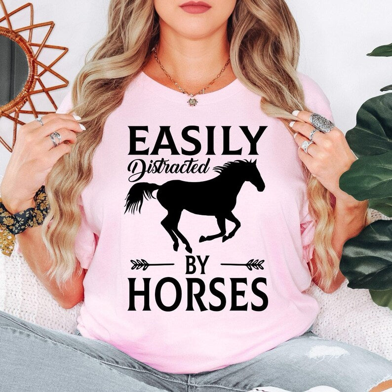 Funny horse lover shirt designed for equestrians, horse riders, ranch owners, stable workers and country lifestyle enthusiasts. Perfect for riding schools, equestrian competitions, horse shows, farm visits and outdoor adventures. Every premium graphic t-shirt is professionally printed in the UK by TeezoraPrints, delivering vibrant print quality and long-lasting comfort.