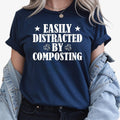 Easily Distracted by Composting shirt, funny gardening t shirt, compost lover tee, gardener gift, allotment shirt, eco-friendly clothing, sustainable living apparel, organic gardening shirt, plant lover gift, humorous gardening top and novelty compost graphic tee. Professionally printed in the UK by TeezoraPrints using premium cotton for superior comfort and everyday wear.