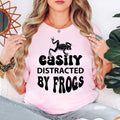Perfect for hiking trips, camping weekends, nature walks, pond visits, wildlife parks, eco festivals, outdoor adventures and casual everyday wear. This Easily Distracted by Frogs shirt combines comfort, humour and style, while every premium t-shirt is professionally printed in the UK by TeezoraPrints using high-quality materials.