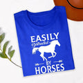 Perfect for horse riding lessons, stable visits, equestrian competitions, country fairs, ranch work, outdoor adventures, farm weekends and casual everyday wear. This Easily Distracted by Horses shirt combines comfort, humour and style, while every premium t-shirt is professionally printed in the UK by TeezoraPrints using high-quality materials.