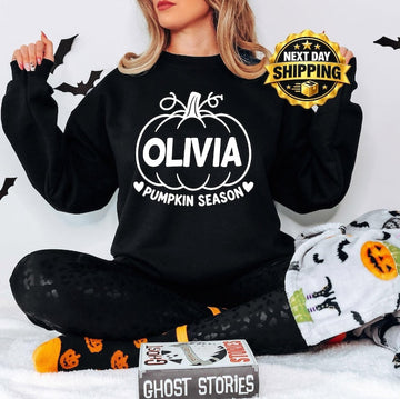 Personalised Pumpkin Season sweatshirt featuring a custom printed name and bold pumpkin artwork, designed as a fun autumn jumper for pumpkin picking, Halloween celebrations, seasonal photographs and cooler days. This personalised sweatshirt is a thoughtful custom clothing gift for mums, sisters, friends, daughters and anyone who enjoys autumn traditions and pumpkin season.