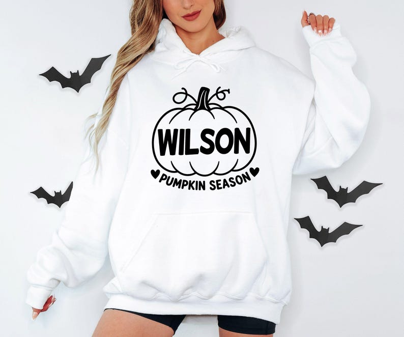Personalised Pumpkin Season hoodie featuring a custom printed name inside a classic pumpkin design, created for autumn lovers and Halloween fans. This custom name hoodie is ideal for pumpkin picking, pumpkin patch visits, seasonal photographs, Halloween gatherings and cosy autumn days, making a thoughtful personalised clothing gift for mums, sisters, friends and family.