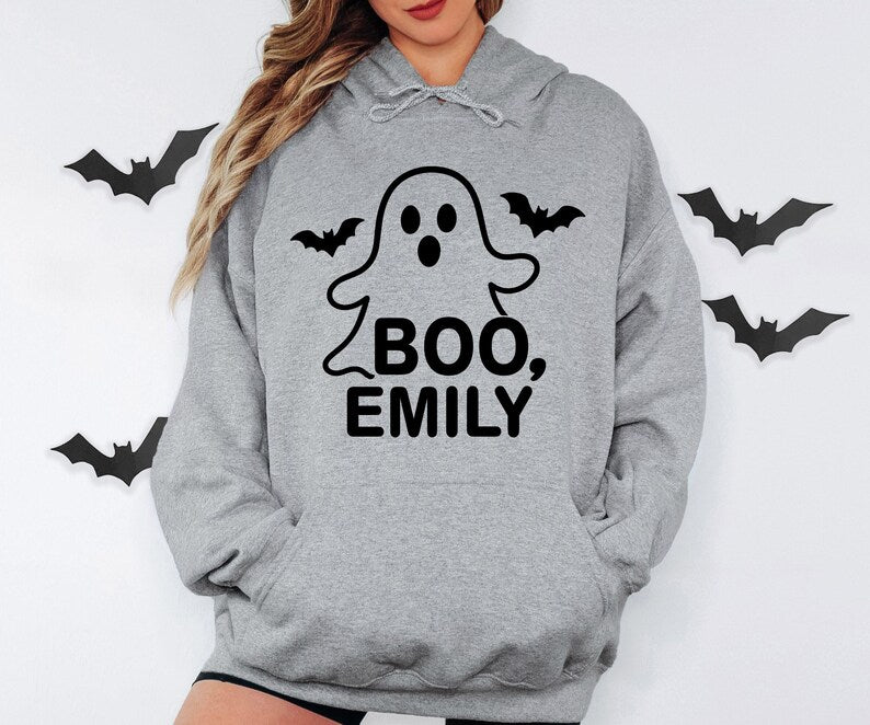 Cute personalised Halloween hoodie with a friendly ghost and custom name design, perfect spooky season clothing for Halloween celebrations, trick or treating, costume parties, family Halloween outfits, autumn events and thoughtful personalised gifts for friends and family.