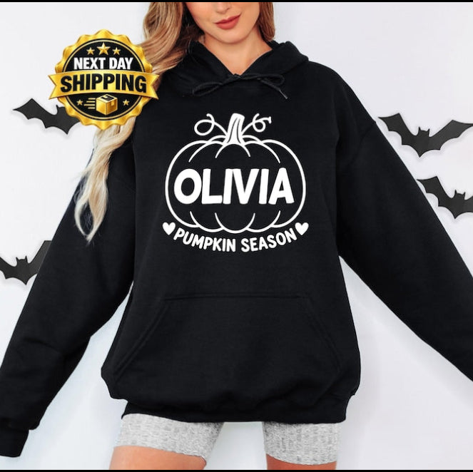 Personalised Pumpkin Season hoodie featuring a custom printed name inside a classic pumpkin design, created for autumn lovers and Halloween fans. This custom name hoodie is ideal for pumpkin picking, pumpkin patch visits, seasonal photographs, Halloween gatherings and cosy autumn days, making a thoughtful personalised clothing gift for mums, sisters, friends and family.