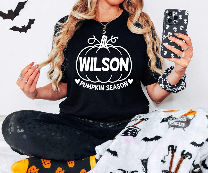 Personalised Pumpkin Season T Shirt featuring a custom printed name inside a pumpkin design, ideal for women who love autumn, Halloween, pumpkin picking and seasonal celebrations. Custom name T-shirt suitable for autumn outfits, Halloween parties, pumpkin season events and thoughtful personalised gifts for mums, sisters, friends and family.