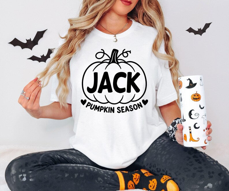 Personalised autumn T-shirt with a custom name displayed inside a pumpkin design and Pumpkin Season wording. This seasonal shirt is perfect for pumpkin picking trips, Halloween parties, autumn events, family photographs and cosy seasonal days. A thoughtful personalised gift for her, mum, sister, friend or anyone who enjoys pumpkin season.